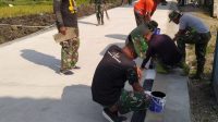 Satgas TMMD Reguler Ke-116 Kodim 0735/Surakarta Kebut Pengecatan Lis Jalan