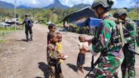 Minggu Kasih Satgas Yonif 323 Buaya Putih Berbagi Dengan Masyarakat